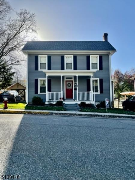 Cute as a button renovated circa 1900 Colonial, with a front porch. Located in a charming town with 
