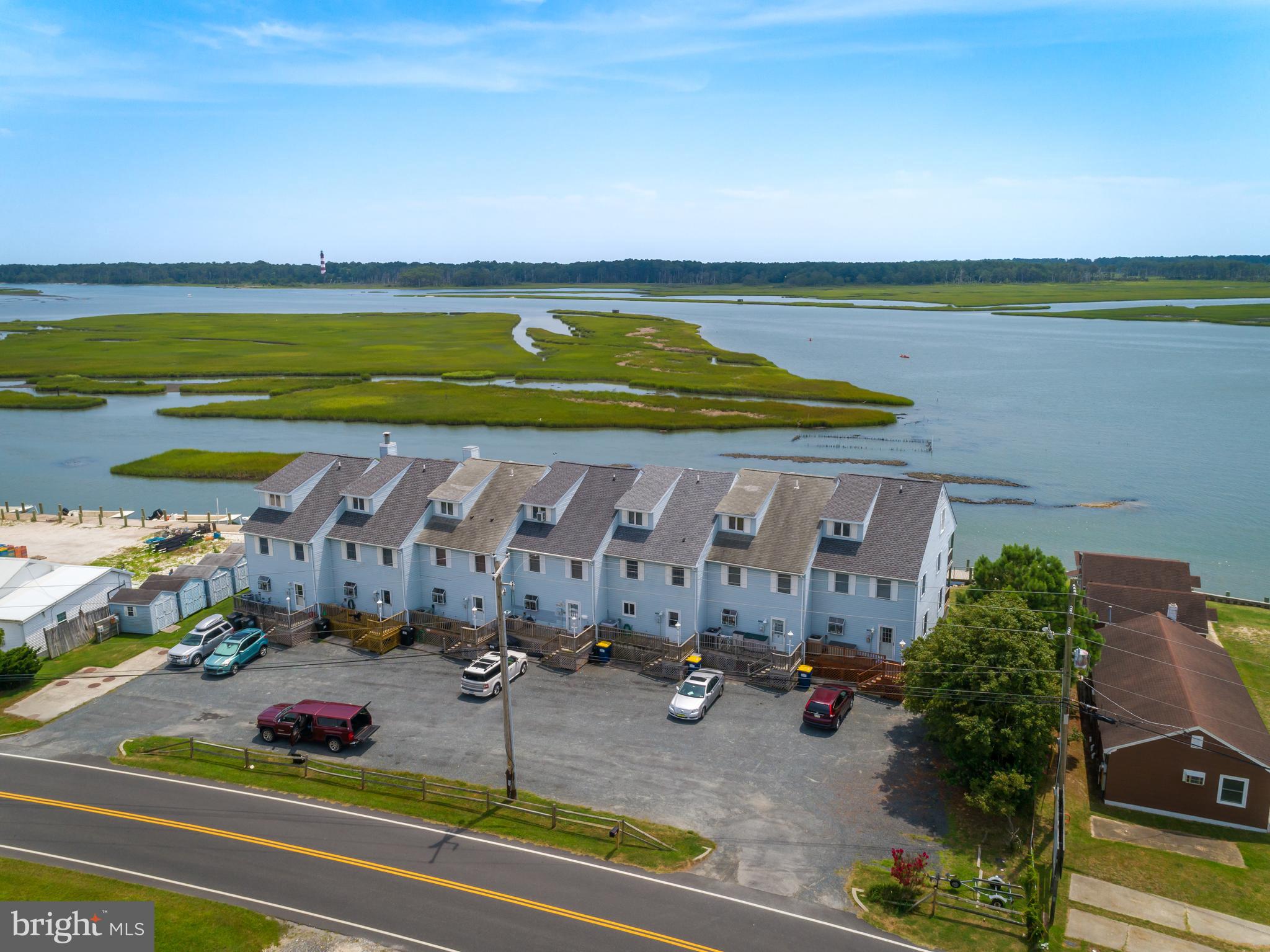 7548 East Side Road is a beautiful 3 story townhome with a deep water dock, overlooking Assateague I