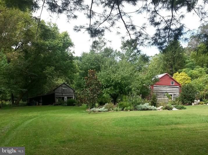 Rustic 1 bedroom 1 bath log cabin style home built in 1856 with a beautiful setting on 5.22 acres. 
