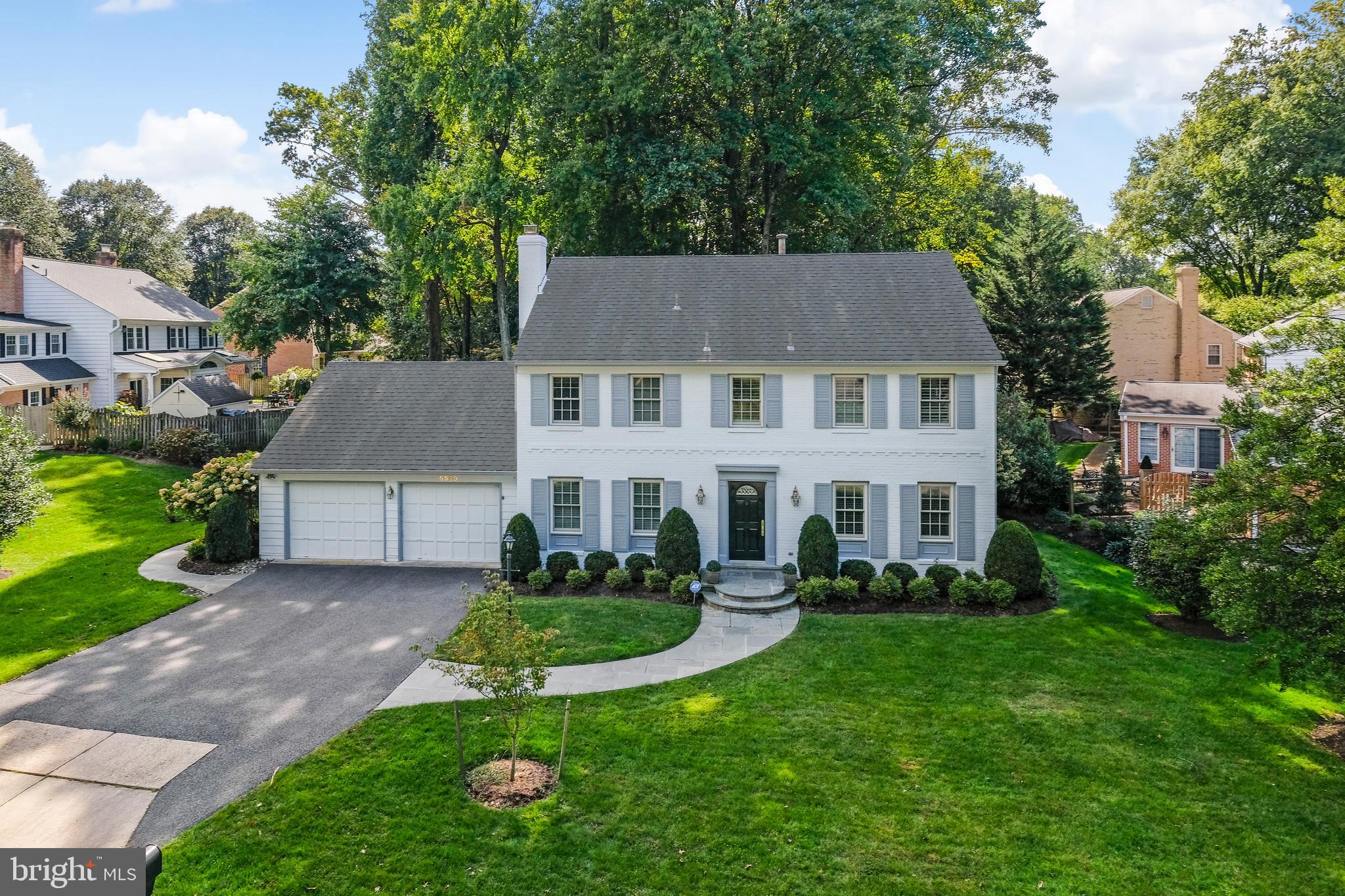 Fall in love with 6539 Windermere Circle; this elegant painted brick colonial is sited on a private 