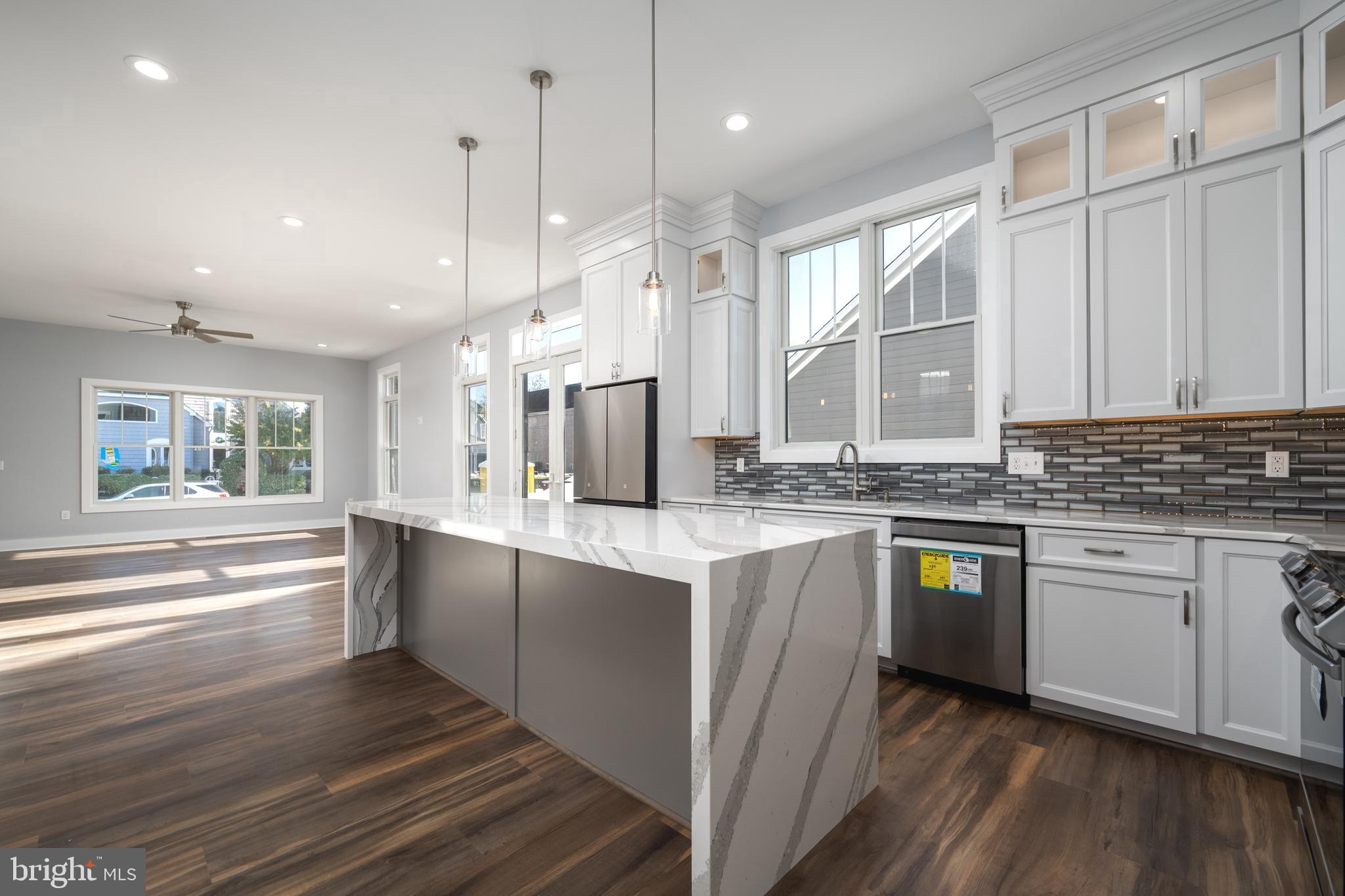 IMPRESSIVE BRAND NEW CONSTRUCTION BY J.B. BUILDERS IN THE HEART OF DOWNTOWN LEWES.  A Spacious 2 Story, 4 Bedroom, 3.5 Bath, 2,592 Square Foot Home with a Bright Open Floor Plan and Beautiful Luxury Vinyl Plank Flooring throughout. 10'6 Ceilings on the entire First Floor with an Upscale Gourmet Kitchen and Dining Area with a Walk-In Pantry, Anderson 400 Series windows, Extra Shelving in all Closets, Cement Conditioned Crawl Space and Full Yard Irrigation with Sod and 2 Zoned HVAC. Relaxing Rear Fenced-In Paver Patio along with a Paver Driveway and Front Paver Walkway. Walk or Bike to downtown Lewes, the Beaches, the State Park and all Shopping. 1 Block from George  H. P Smith Park, Blockhouse Pond and the Historic Lewes Farmers Market. Also 2 Blocks to Beebe Hospital. Don't Miss this Opportunity with Terrific Value.
