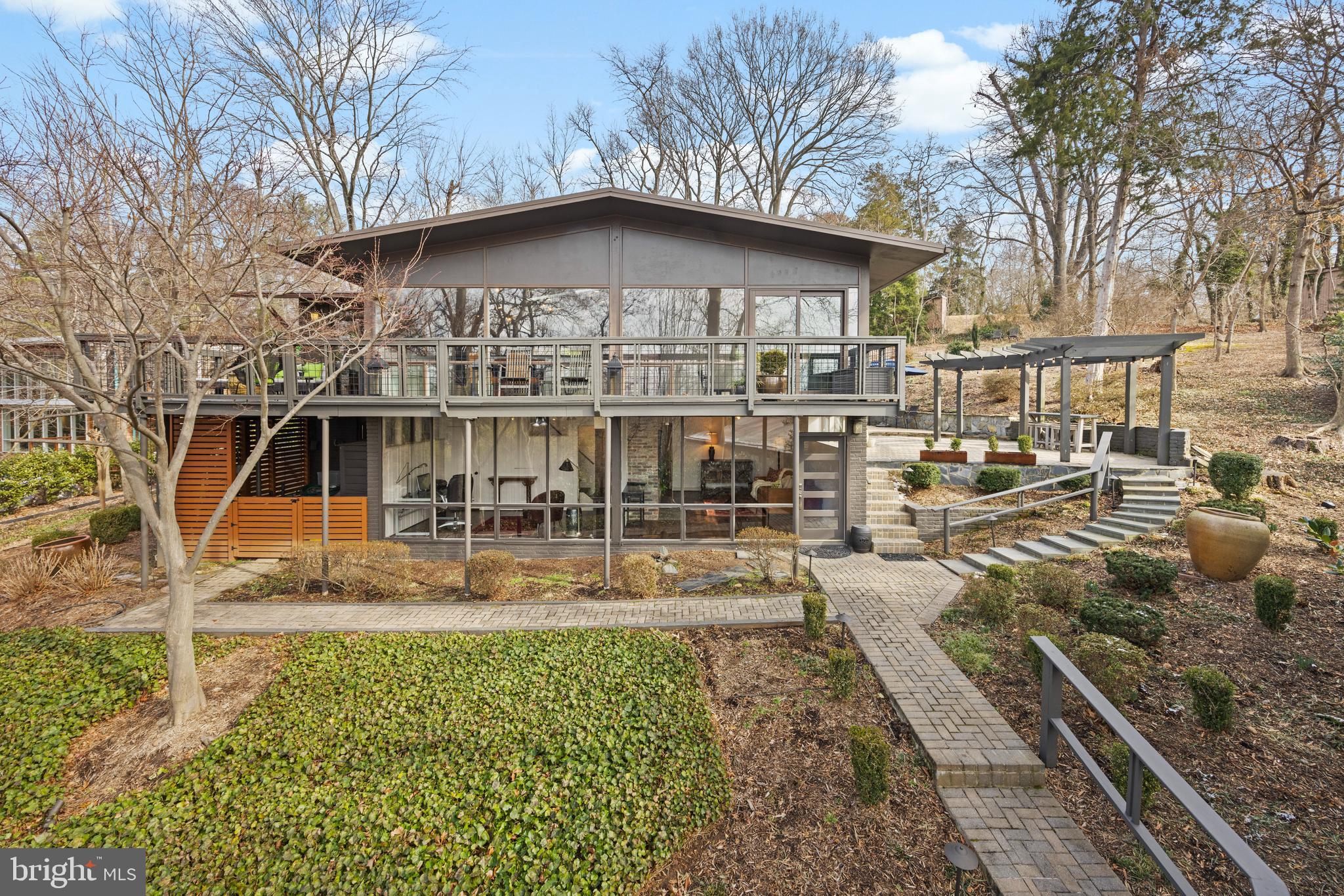 Artfully one of the best offerings in Hollin Hills.  This contemporary  2 level mid-century modern h