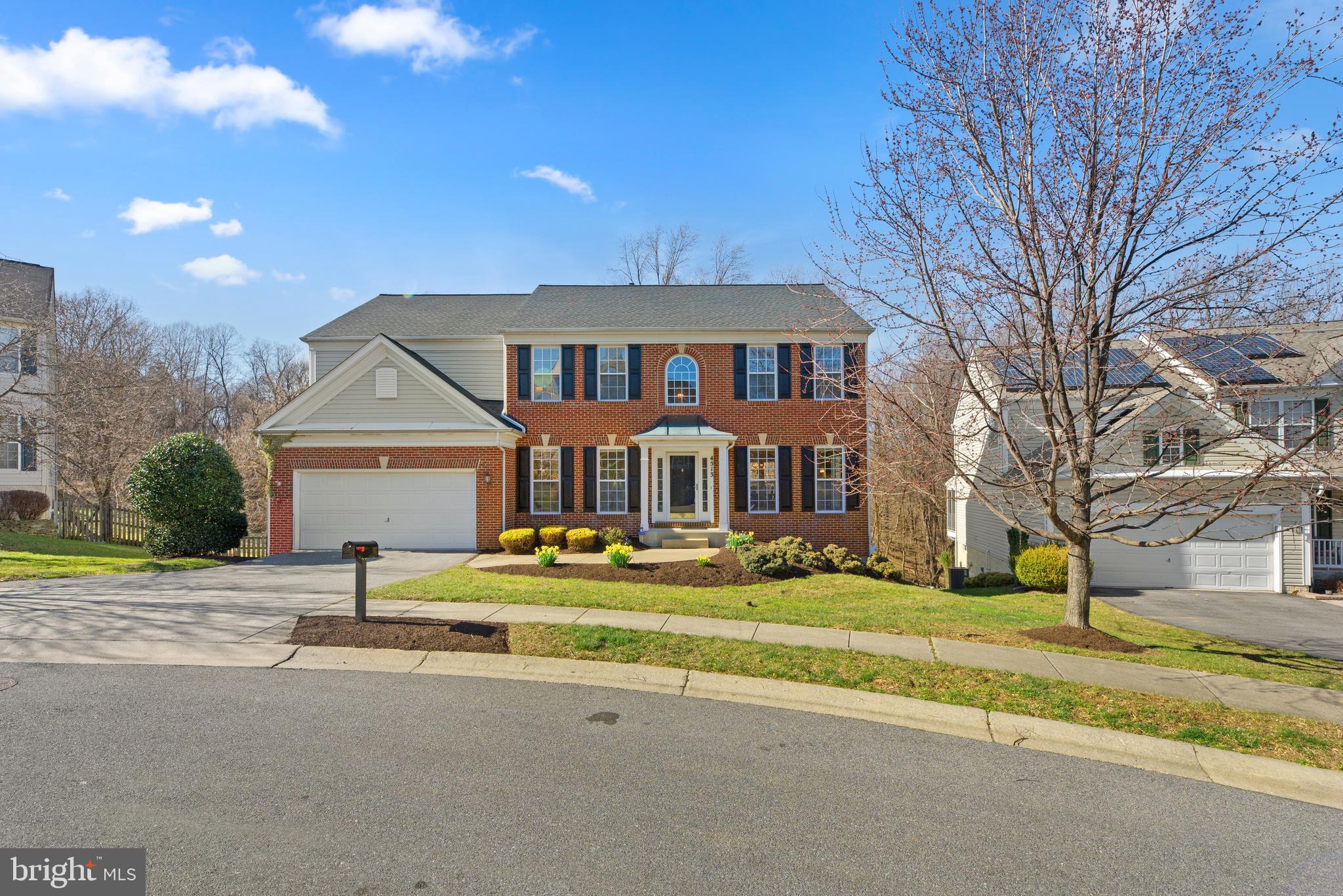 Must see brick front 2-car garage colonial w/over 4,000 finished sq ft on a premium lot backing to f