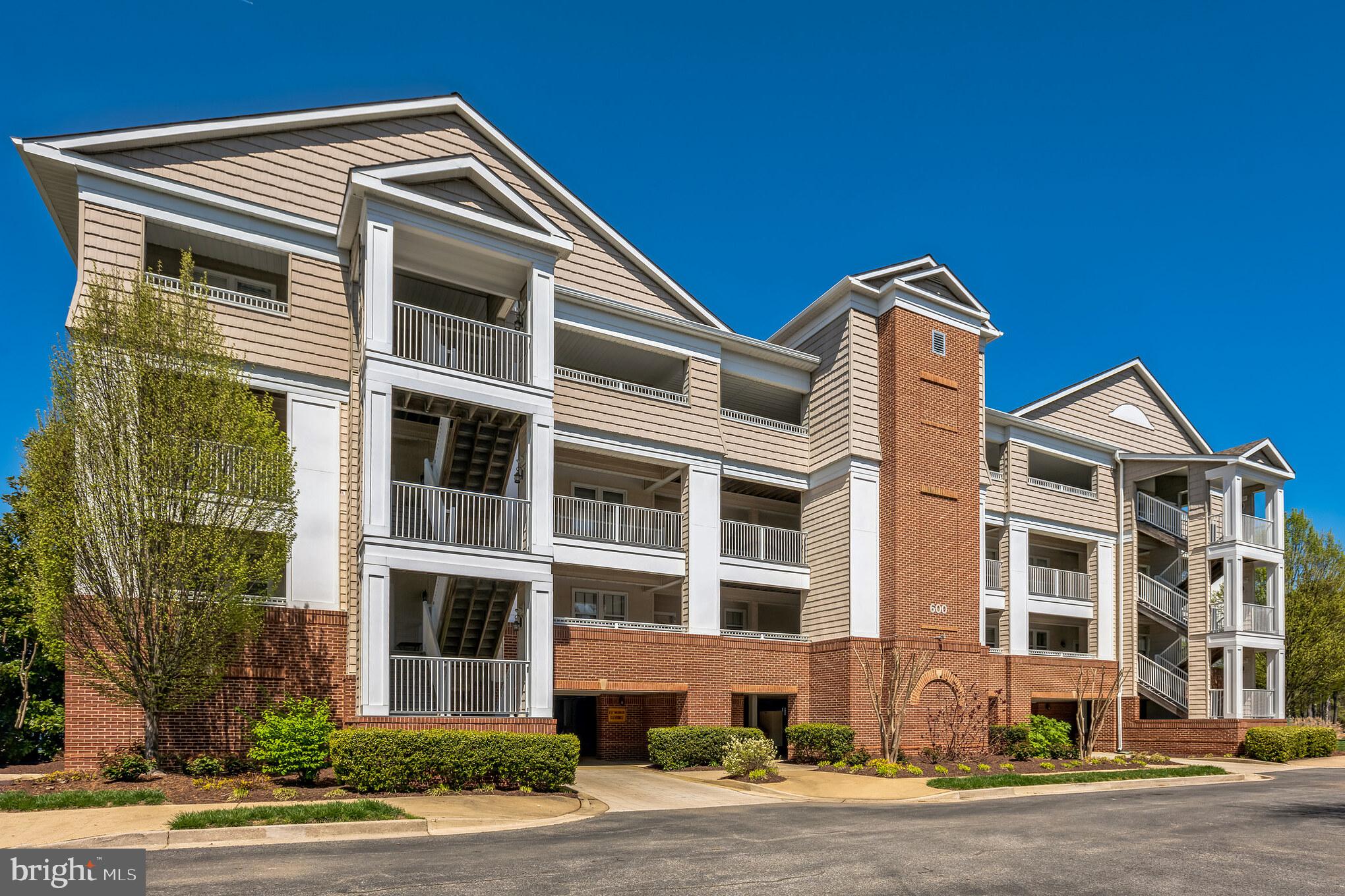 Beautiful  Oyster Bay corner unit condo. (Weatherly floor plan) with breathtaking 180° views of Back Creek. This contemporary condo was completely renovated in 2018. New paint, flooring, carpet, appliances including washer and dryer. This unit has a cozy balcony where you can enjoy peaceful  sunsets in the evening  that are like icing on the cake! Views through the home overlooking the water are gorgous. The balcony has an extra storage closet ( unique to this building).  Open floor plan features a remarkable primary bedroom and bath, 1 additional bedroom/office . Beautiful kitchen with granite countertops. This condo also has a deeded boat slip 6 H. Oyster Bay waterfront  community has so much to offer from boating, tennis/pickleball courts, Kayaking, gym, clubhouse and an inground pool.  There is covered under ground parking, and  overflow parking  also available. Private storage area and access via elevator or stairs. The gardens are professionally landscaped.  Owner would need a rent back. They are building a home. This is the Weatherly floor plan.