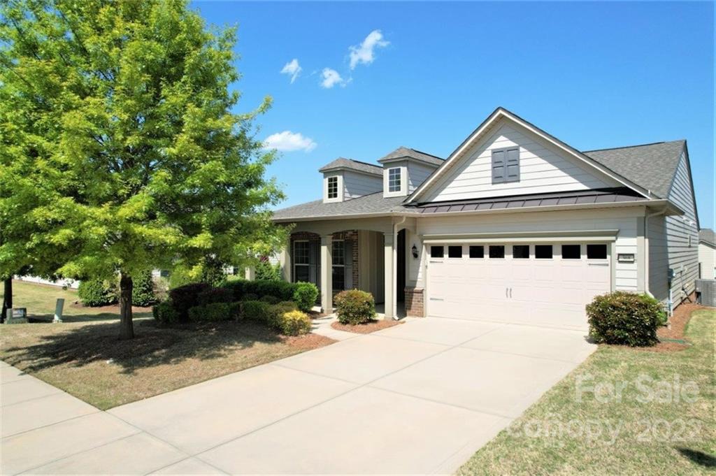 Don't miss this popular 1-story Abbeyville in the amenity-rich Carolina Orchards Subdivision. 2 BR/2 Bath+Sunroom + Office with French doors.  Great Room w/fireplace. Open floorplan great for entertaining. Kitchen features granite counters, stainless appliances, refrigerator, gas cooktop, direct vent hood, oven/microwave combo, cabinet convenience package includes full extension drawer guides w/quiet closing mechanism, dovetail drawers, self-closing door hinges, roll out trays, & integrated waste basket, large island w/pendant lights. 4' extended garage w/windows, pull-down attic storage, garage door keypad. Hardwood laminate & tile throughout, carpet in 2nd BR. Cased windows and lots of crown molding. Laundry Rm includes washer/dryer, laundry sink, lots of cabinets + walk-in pantry. Large paver patio off Sunroom. Energy efficient Radiant Barrier Sheathing. 
Tons of amenities, full-time activities director, numerous clubs & activities to choose from. A great place to call home.