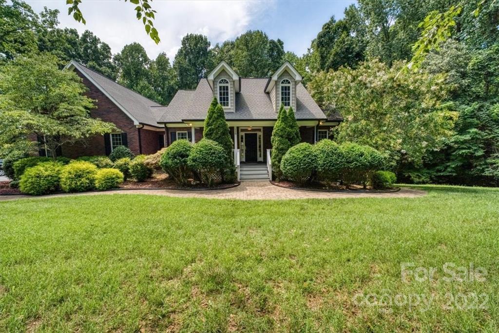 This water view gem offers a superb location~5 mins to LKN State Park, 10 mins to Mooresville, & 15 mins to Statesville.  Lots of privacy on a wooded lot just steps from the lake. A full unfinished walkout basement that is 2115 square feet with high ceilings that is ready for you to make it your own. The plumbing for a bathroom ready to go! This home is immaculate which better than new! New "Tyvek" deck installed in 2016. New HVAC in 2017. This stunning all brick beauty that boasts warm neutral colors, beautiful hardwood floors, gourmet kitchen w/tile backsplash, stainless steel appliances with cathedral ceiling in the great room w/cozy fireplace. A huge bonus room above the garage.  Hurry & don't let this one slip away!