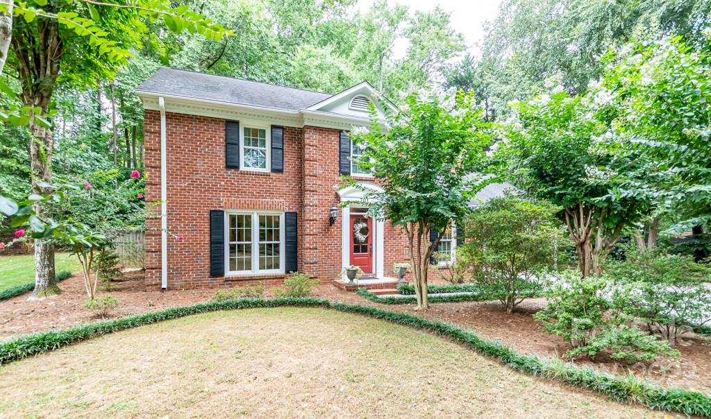 Full brick stately home in south Charlotte nestled on a huge lot with mature landscaping for privacy.  New water heater 2022, new HVAC 2020, Fireplace insert 2020, New carpet on the stairs and upstairs 2021, Kitchen renovated 2014, Windows replaced 2009, Leaf Guard gutters installed 2010, Roof replaced 2010, Carport added in 1988 to include additional heated/cooled office/hobby space and storage room.  Private back yard is serene and beautiful with meticulous landscaping.  Kitchen was renovated to include newer stainless appliances, granite counter tops, and farm sink.  Cozy den offers a brick fireplace with an insert and cathedral ceilings.  Private room off of the garage is perfect for an office or hobby room.